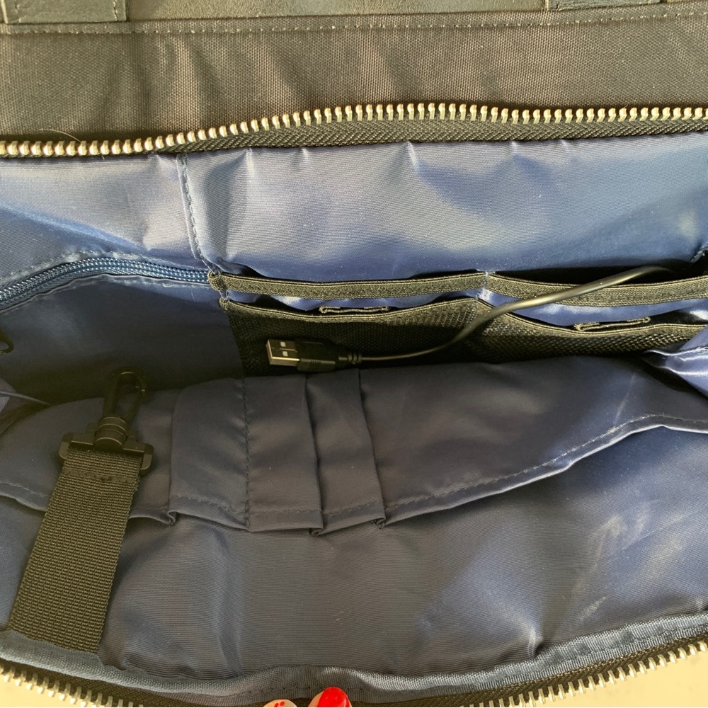 Black Travel Bag with Structured Design and Metal Feet - Picture 11 of 16